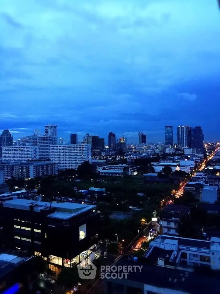 Stunning cityscape view showcasing urban skyline at dusk with vibrant lights and expansive horizon.