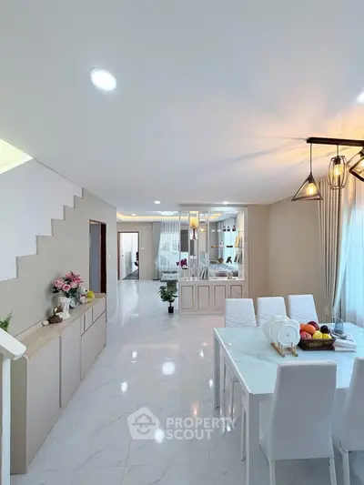 Spacious modern living room with elegant dining area and stylish decor