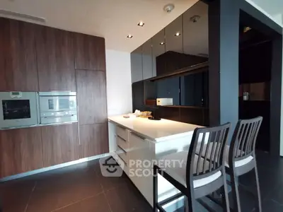 Modern kitchen with sleek cabinetry and built-in appliances
