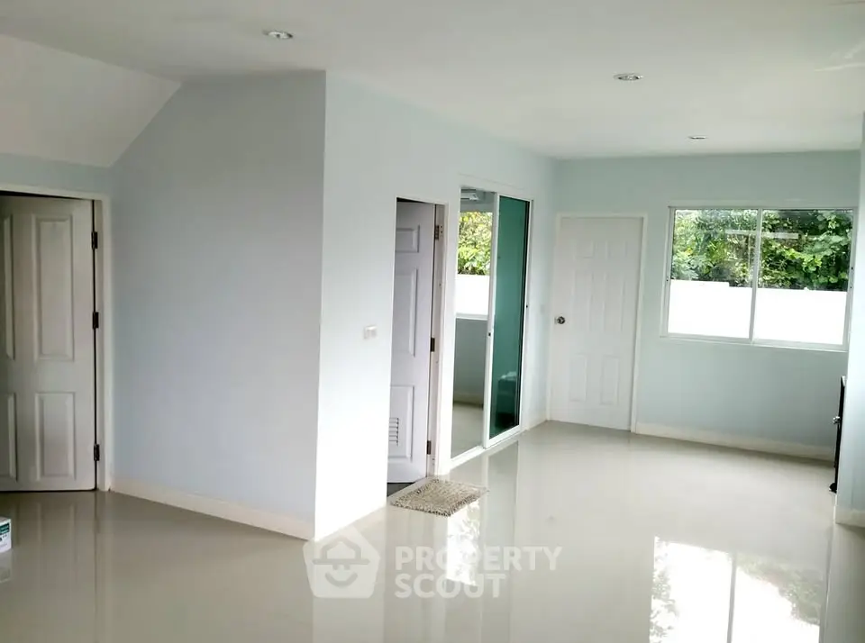 Spacious and bright interior with modern design and large windows.