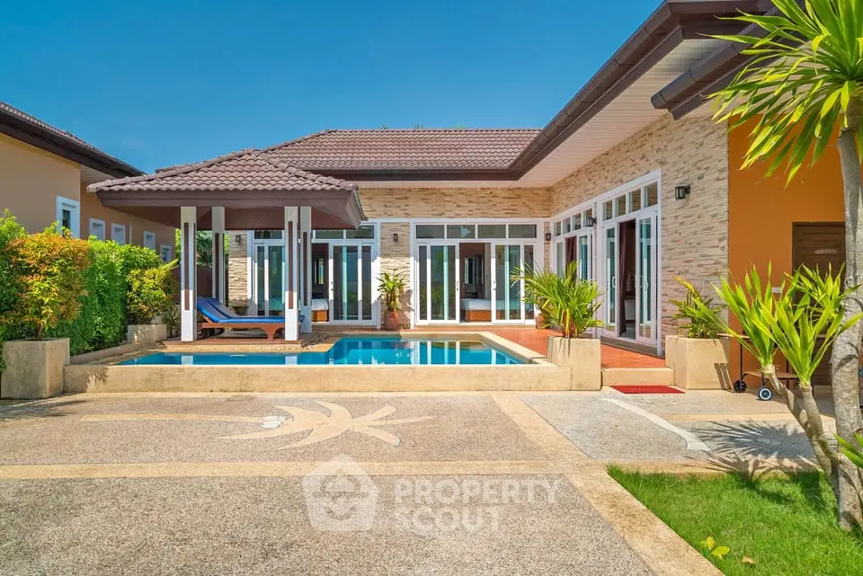 Luxurious villa with private pool and modern design in tropical setting.