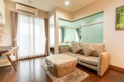 Modern living room with cozy sofa and stylish decor in a bright apartment.