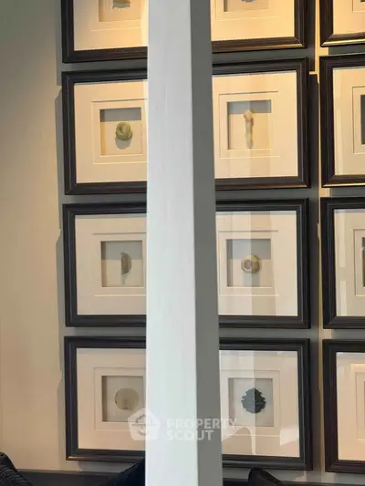 Stylish interior wall with framed art pieces in a modern living space.