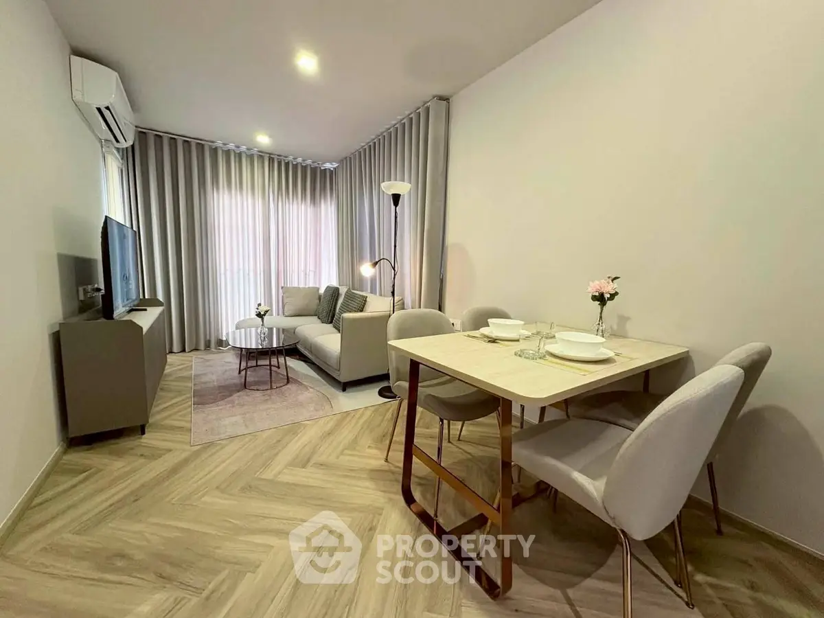Modern living room with elegant dining area and stylish decor
