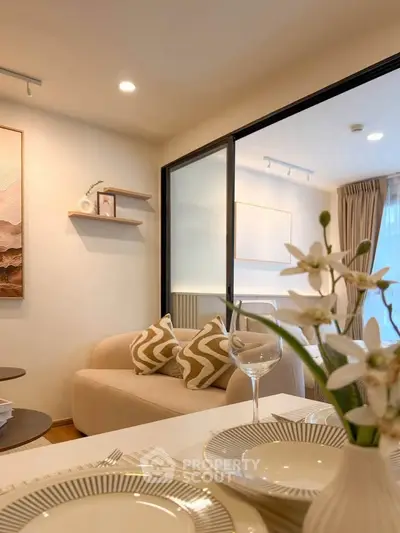 Elegant living room with cozy sofa and stylish decor, perfect for modern living.