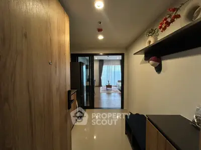 Modern apartment entrance with view into cozy living room