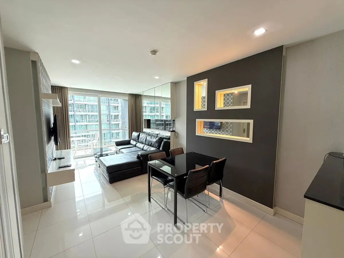 Modern living room with sleek design and city view, featuring leather sofa and dining area.