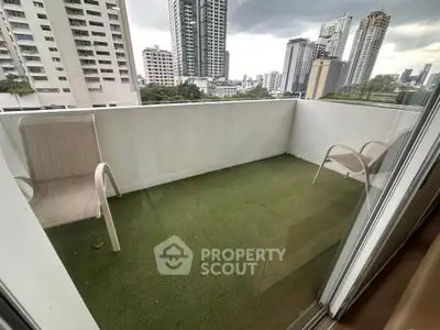 Spacious balcony with city view, perfect for relaxation and enjoying urban skyline.