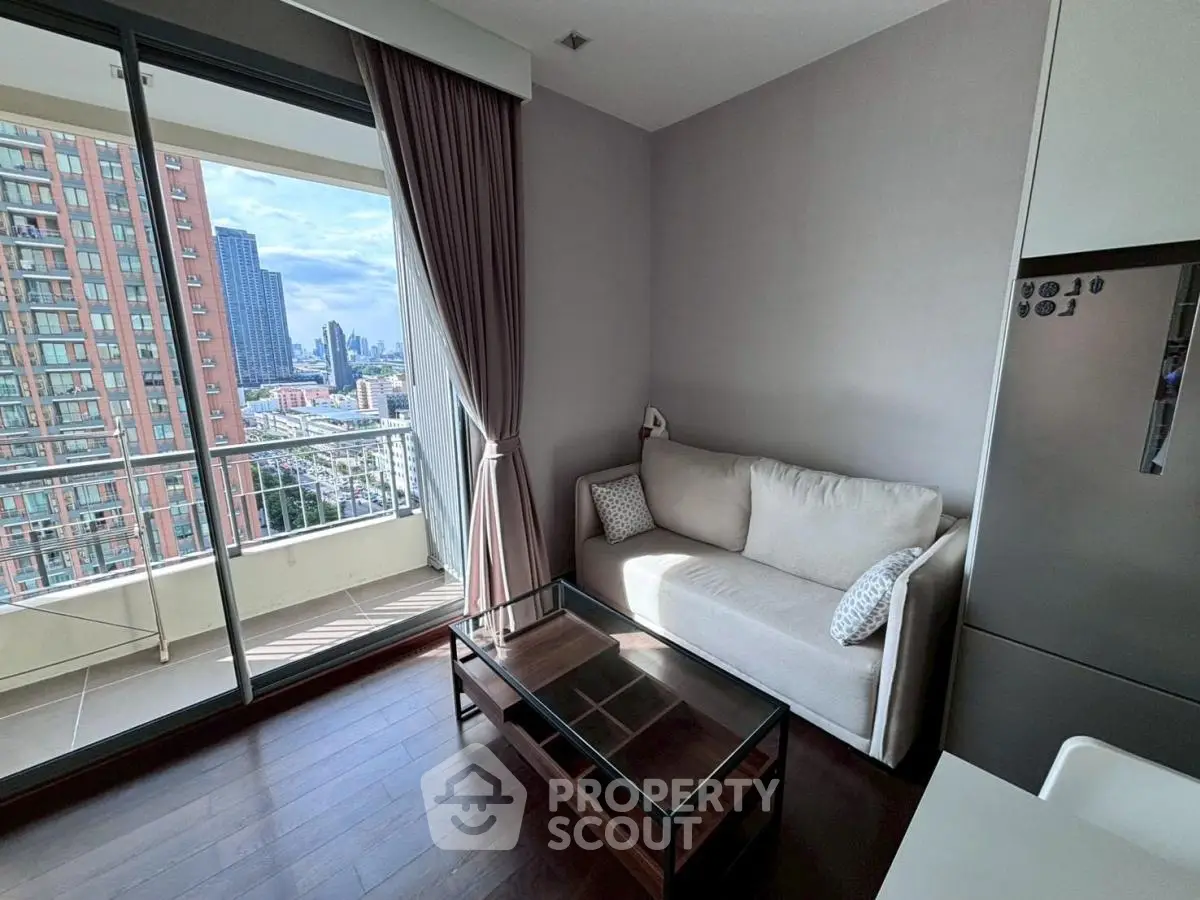Modern living room with balcony view in high-rise apartment