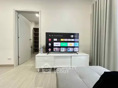 Modern living room with sleek TV setup and minimalist decor
