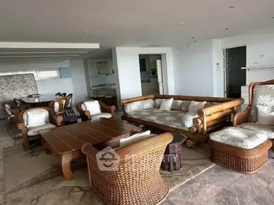 Spacious living room with elegant wicker furniture and open layout
