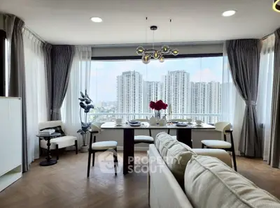 Luxurious living room with panoramic city view and elegant dining area