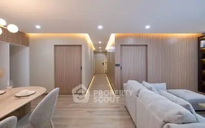 Modern living room with cozy seating and elegant dining area