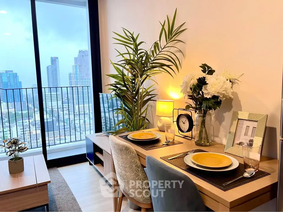 Modern living room with city view, stylish decor, and cozy dining setup.