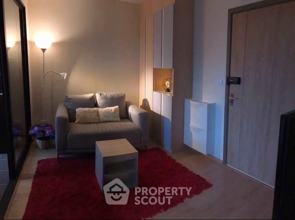 Cozy living room with modern decor and warm lighting, perfect for relaxation.