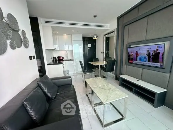 Modern living room with sleek furniture and open kitchen layout