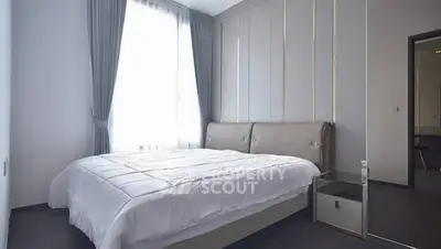 Modern bedroom with elegant decor and natural light