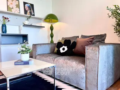 Chic living room with plush sofa, modern decor, and stylish accents for a cozy ambiance.