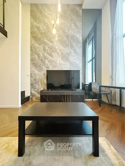 Luxurious modern living room with high ceilings and elegant marble wall