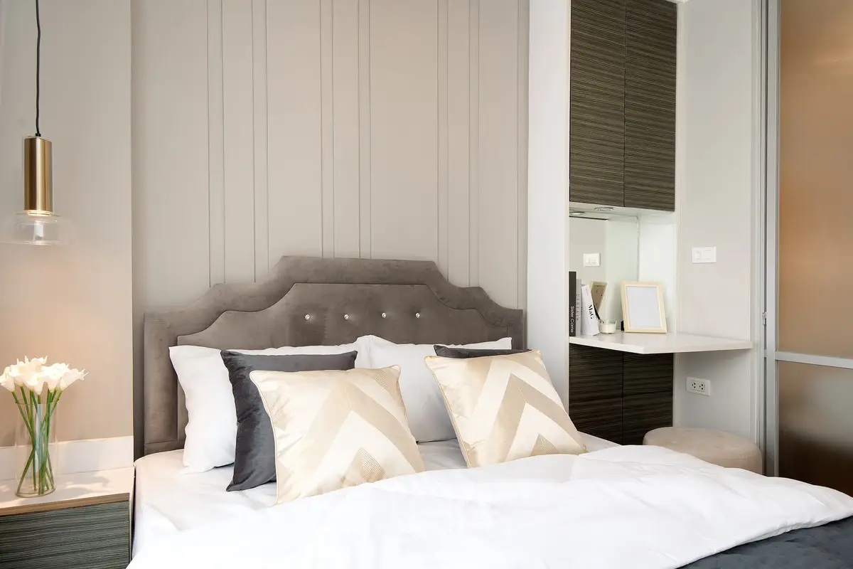 Luxurious modern bedroom with elegant decor and plush bedding