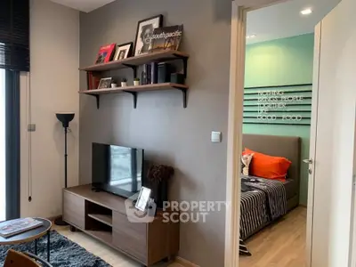 Modern living room with stylish decor and cozy bedroom view, perfect for urban living.