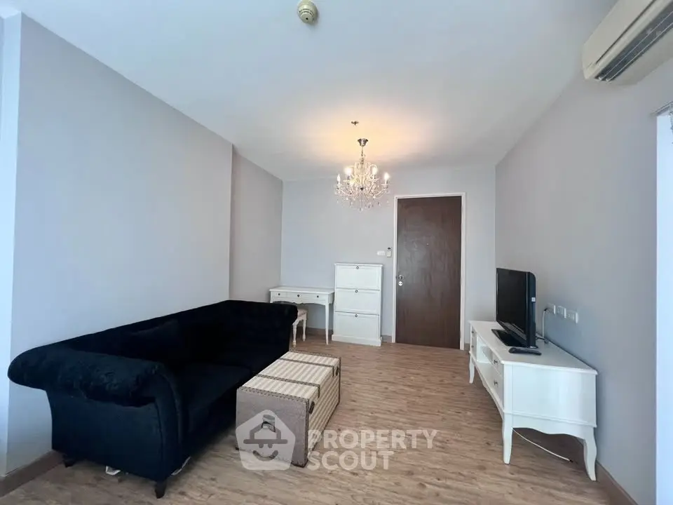 Elegant living room with chandelier and modern furniture