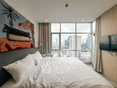 Luxurious bedroom with stunning city view and modern decor in high-rise apartment.