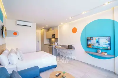 Modern studio apartment with vibrant decor and open layout