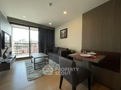 Modern living room with balcony view and stylish furniture