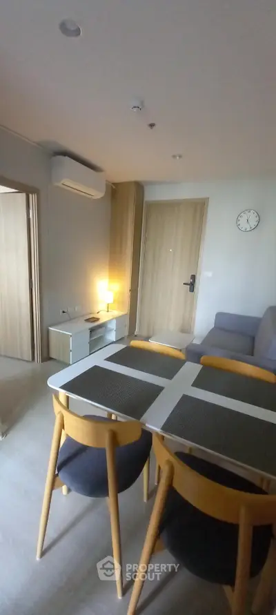 Modern living room with dining area and stylish furniture in a cozy apartment