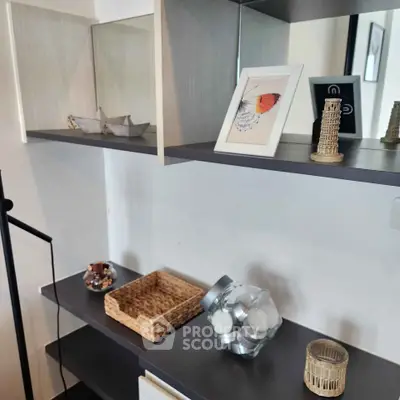 Modern interior shelving with decorative items in a stylish living space.