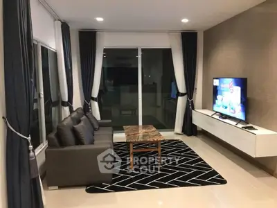 Modern living room with sleek furniture and large windows, perfect for relaxation and entertainment.