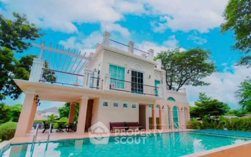 Luxurious villa with private pool and stunning architecture under a clear blue sky.