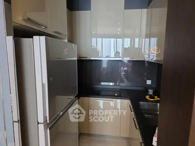 Modern kitchen with sleek cabinetry and stainless steel appliances