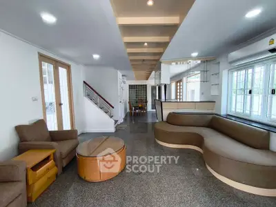 Spacious modern living room with stylish furniture and open layout