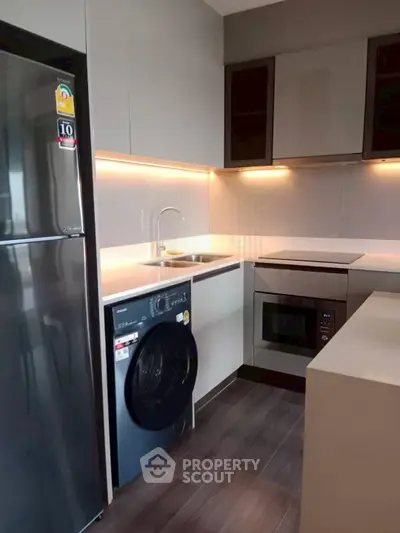 Modern kitchen with sleek appliances and stylish cabinetry