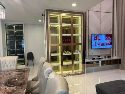 Luxurious living room with elegant decor and modern entertainment setup