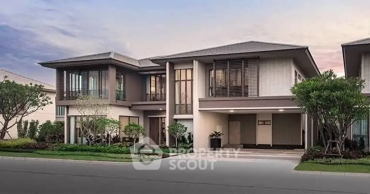 Luxurious modern two-story house with landscaped garden and spacious driveway.