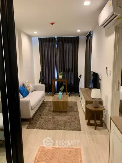 Modern living room with stylish furniture and cozy ambiance in a contemporary apartment.
