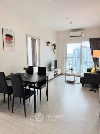 Modern living room with dining area and city view, featuring sleek furniture and natural light.