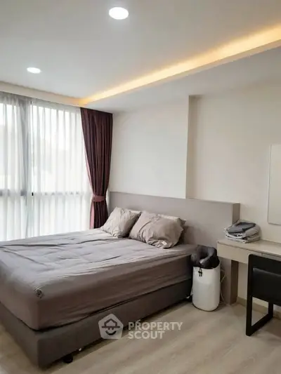 Modern bedroom with cozy bed and stylish decor in a bright apartment
