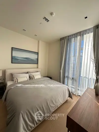 Modern bedroom with large window and stylish decor