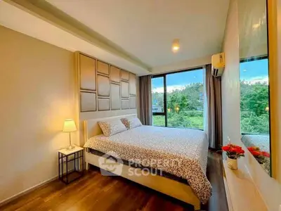 Spacious bedroom with scenic view and modern decor