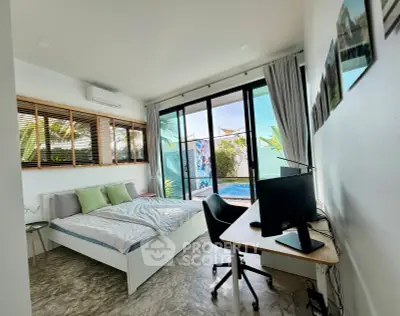 Spacious bedroom with pool view and modern decor, featuring a work desk and large windows.