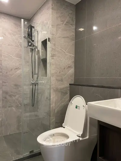 Modern bathroom with sleek shower and contemporary toilet design