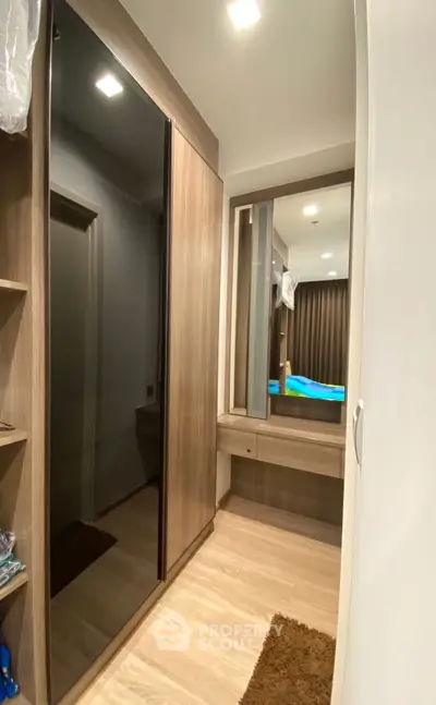Modern bedroom with sleek wardrobe and cozy lighting