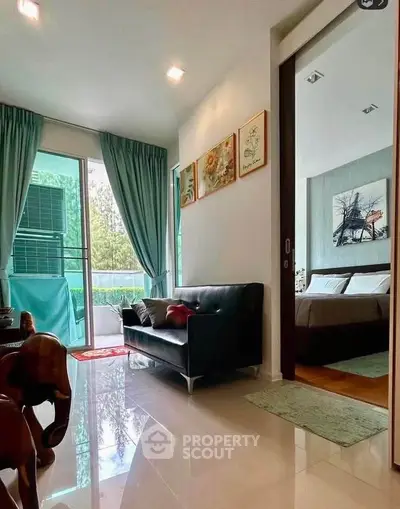 Modern living room with sleek design and balcony view in a stylish apartment.