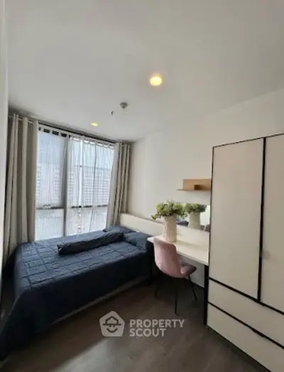 Cozy bedroom with modern decor and natural light