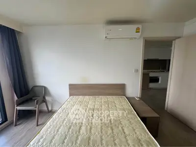 Modern bedroom with air conditioning and minimalist furniture in a stylish apartment.