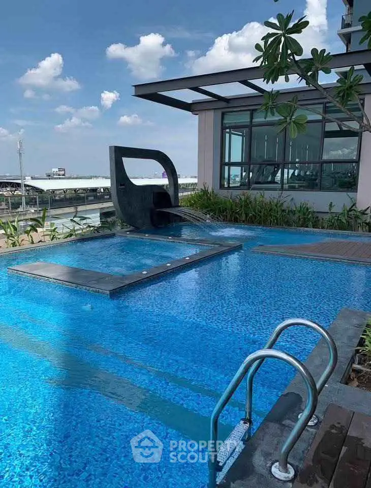 Luxurious rooftop pool with modern design and stunning city views, perfect for relaxation and leisure.